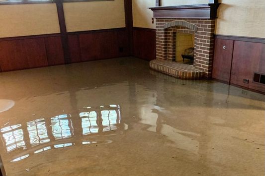 Flooded basement with standing water before water damage cleanup